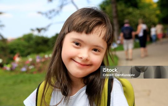 Portrait of little girl smiling in the park